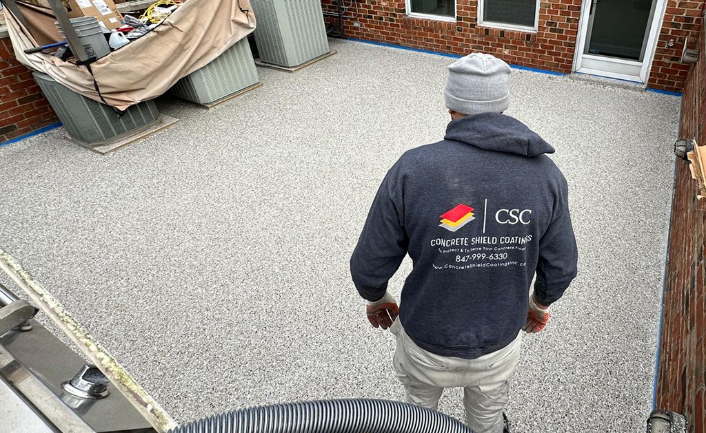 man standing looking at work