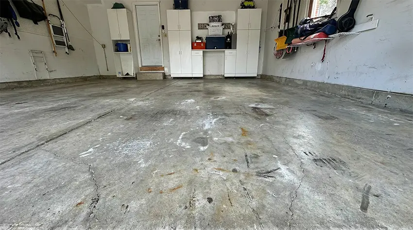 Before: bare concrete garage floor, Deerfield area