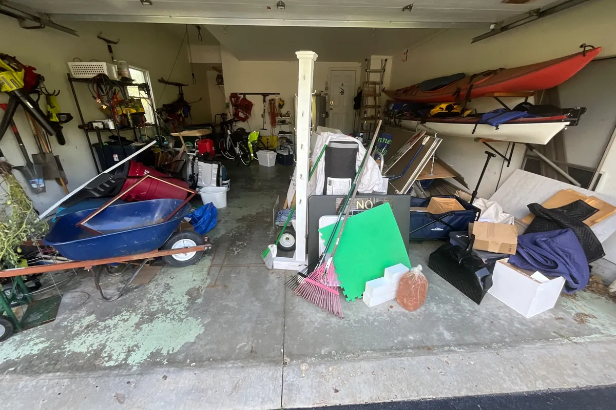Two-car garage in Antioch, IL at the estimate visit, before the garage floor coating was installed