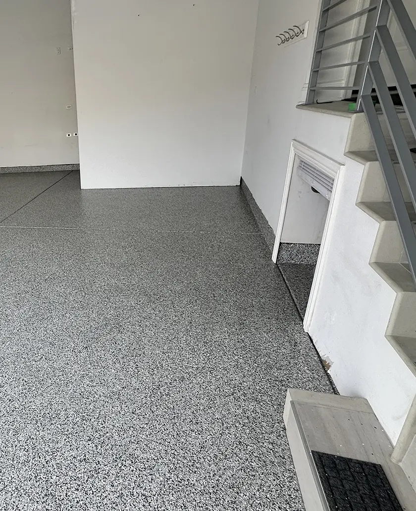 epoxy garage floor coated with gray flakes