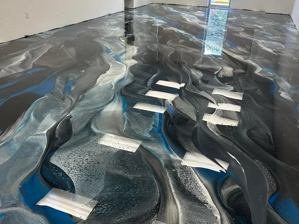 Metallic epoxy floor with flowing swirl effect