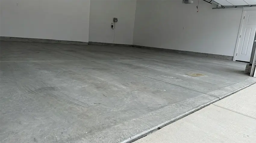 Cracked garage floor before coating, Mundelein IL