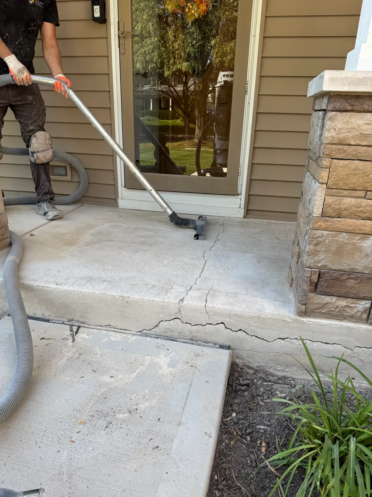 Before: Polyurea flake front porch coating in Creekbed blend in Naperville, IL