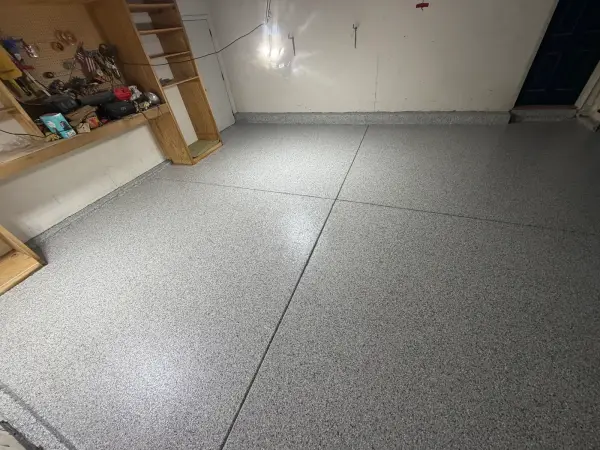 Gray Tidal Wave flake coating with matching cove base along garage walls