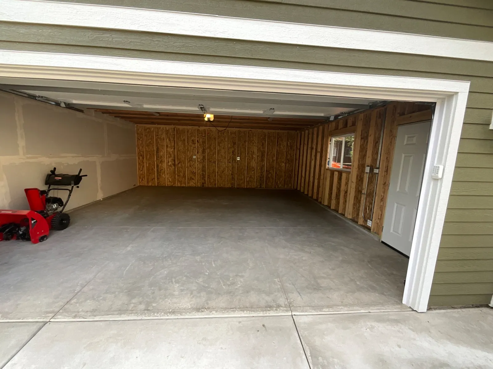 Before: Polyurea Cabin Fever flake garage floor in Arlington Heights, IL