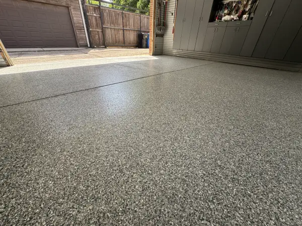 Close view of glossy Gravel blend flake coating on garage floor