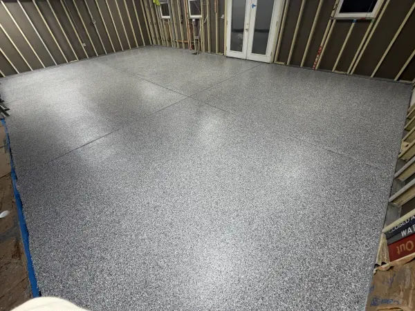 Completed polyurea garage floor in gravel flake blend with high gloss