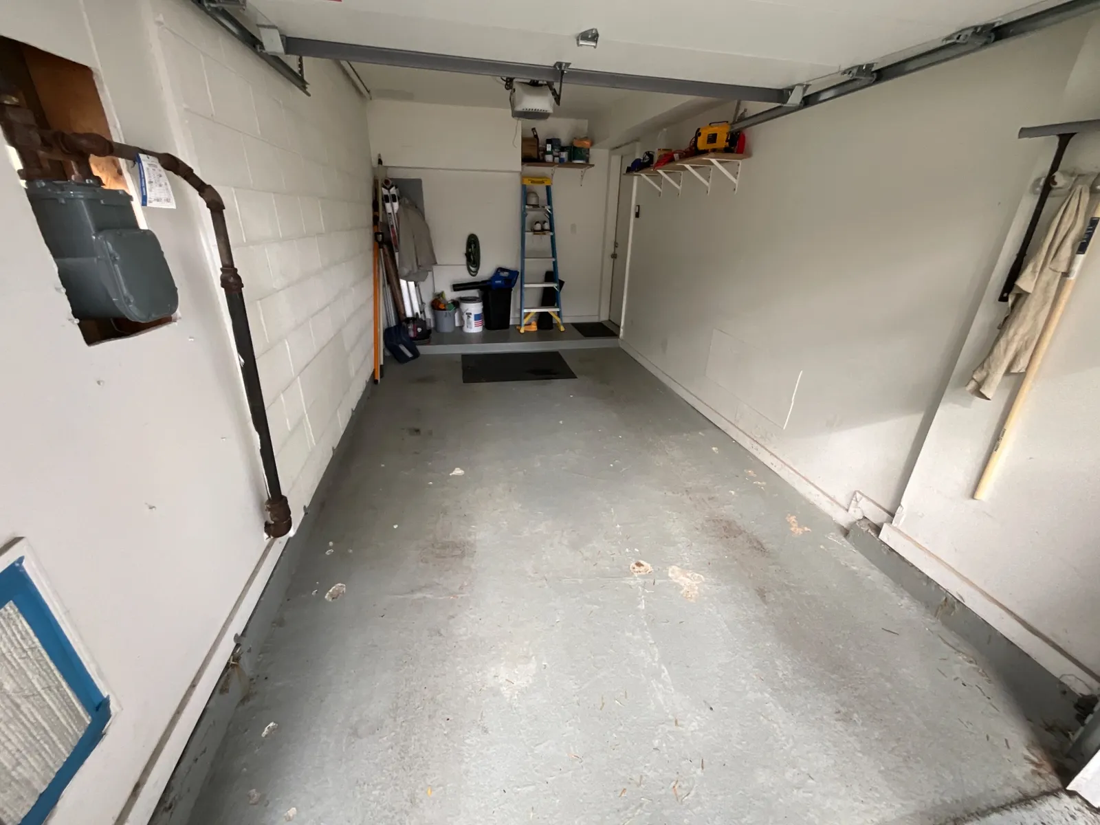 Before: Polyurea Gravel flake floor in a 1-car garage in Chicago, IL