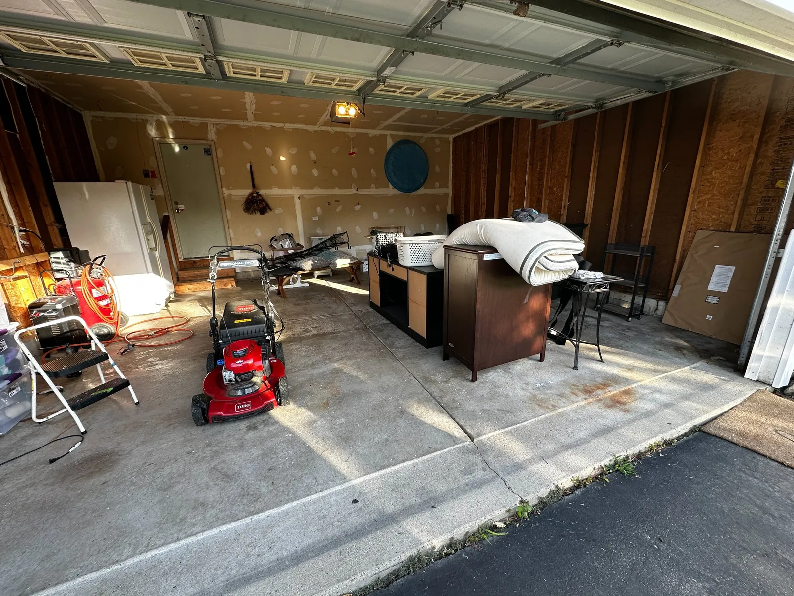 Before: Polyurea Nightfall flake garage floor in Round Lake Beach, IL