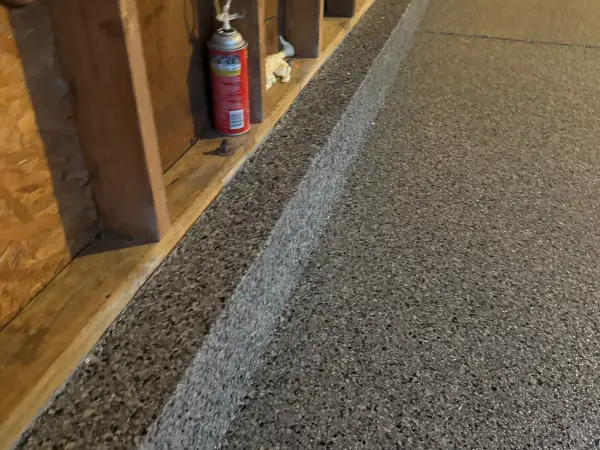 Nightfall flake coating carried up the garage stem wall curb